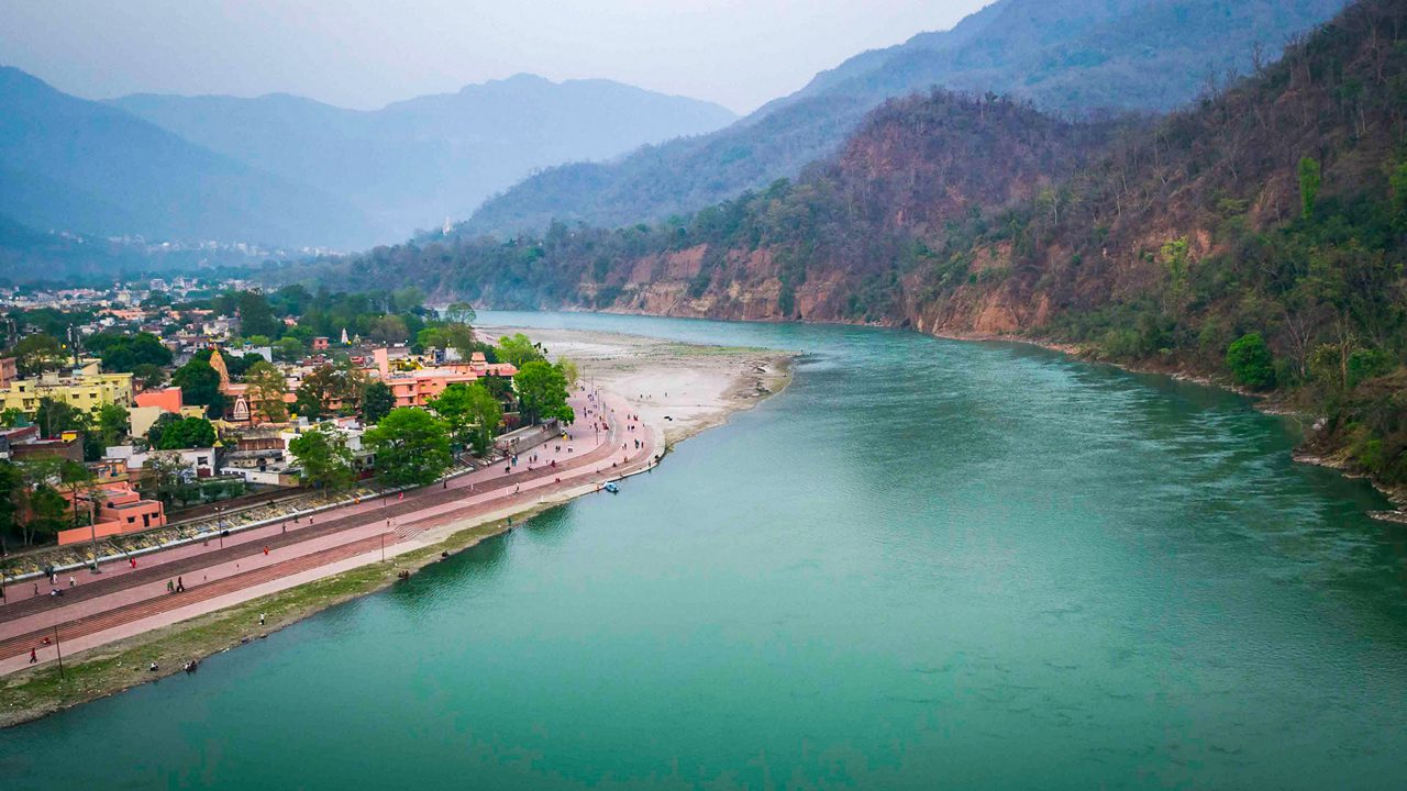 Triveni Ghat at Rishikesh with temples along the sacred Ganga river